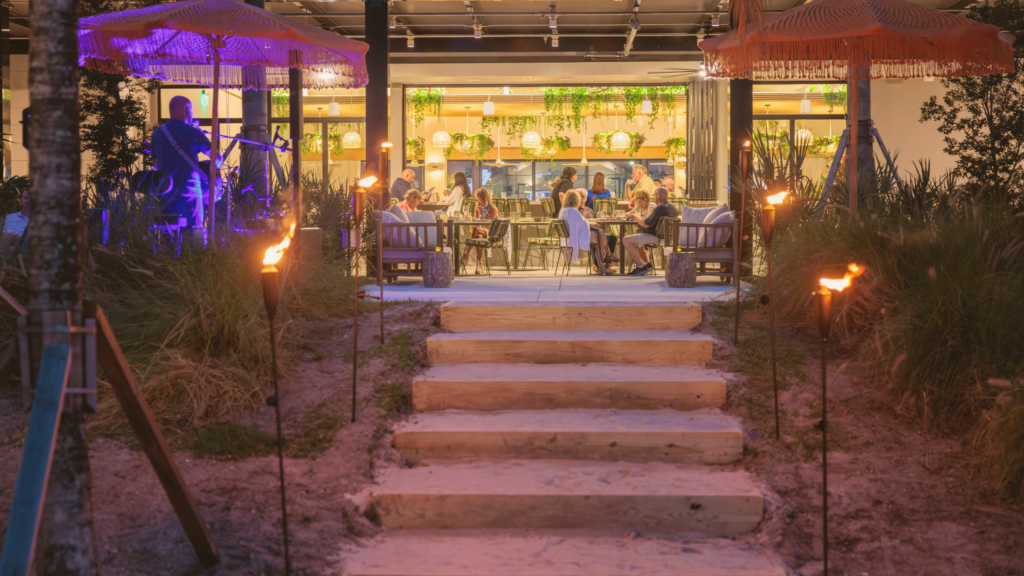 Evening dining with live music and tiki torches at Florida Room Fort Lauderdale