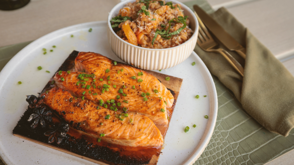 Seared salmon with farro and vegetables served at Florida Room Fort Lauderdale