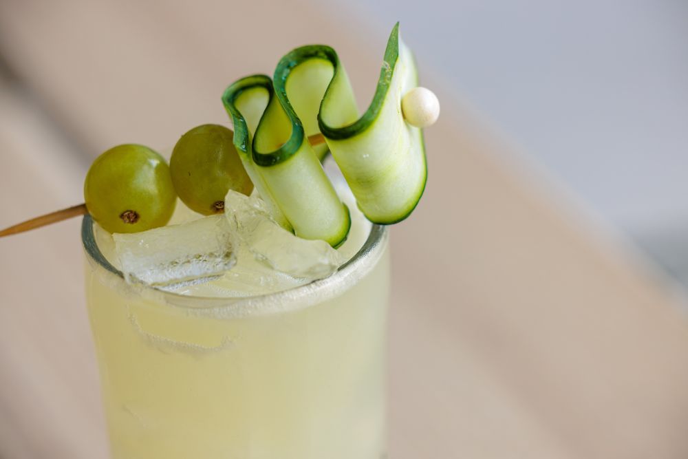 Garden-inspired cocktail with cucumber garnish served at Florida Room.