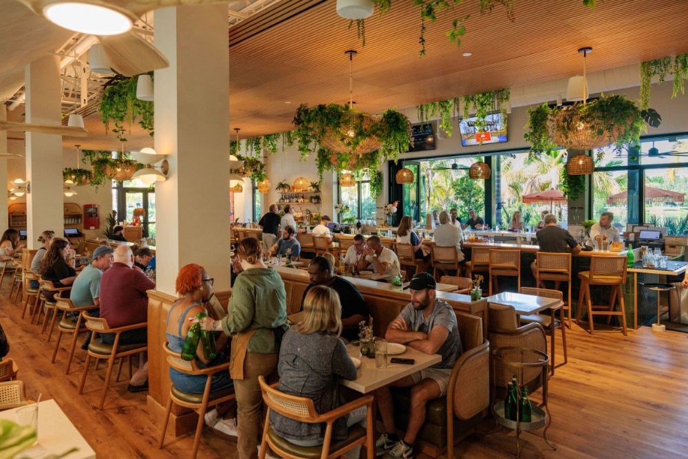 Guests dining inside Florida Room restaurant in Fort Lauderdale.