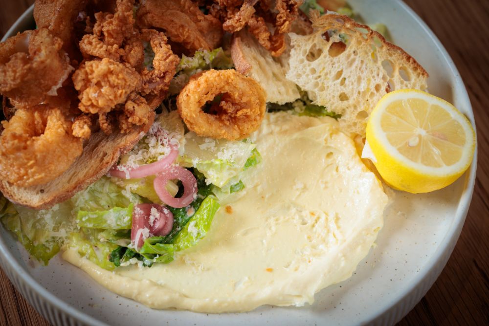 Seed oil free calamari and salad at Florida Room restaurant in Fort Lauderdale.