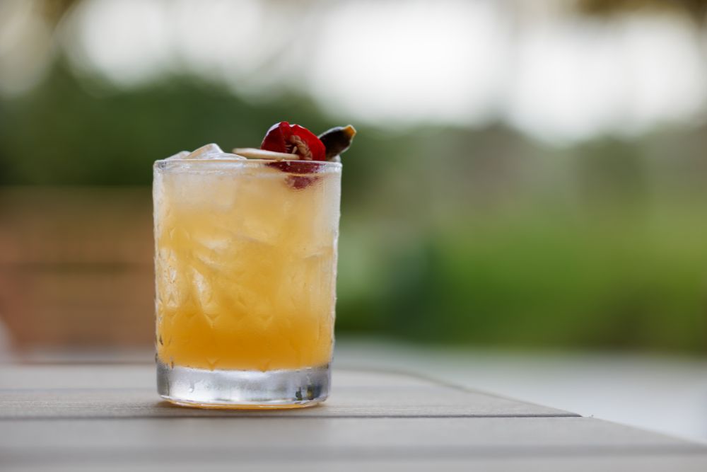 Refreshing citrus cocktail served outdoors at Florida Room in Fort Lauderdale.